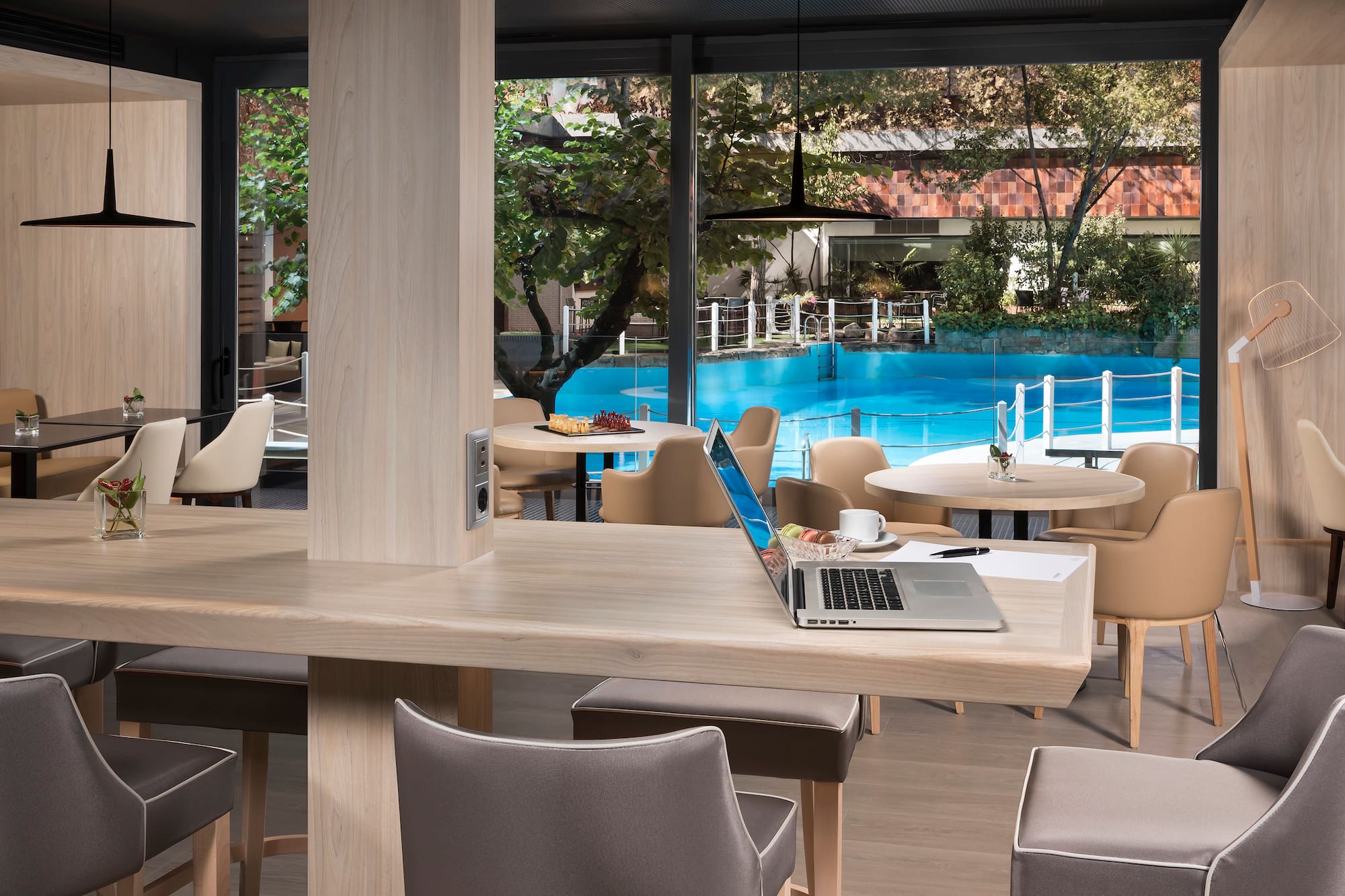 a laptop on a table in a restaurant