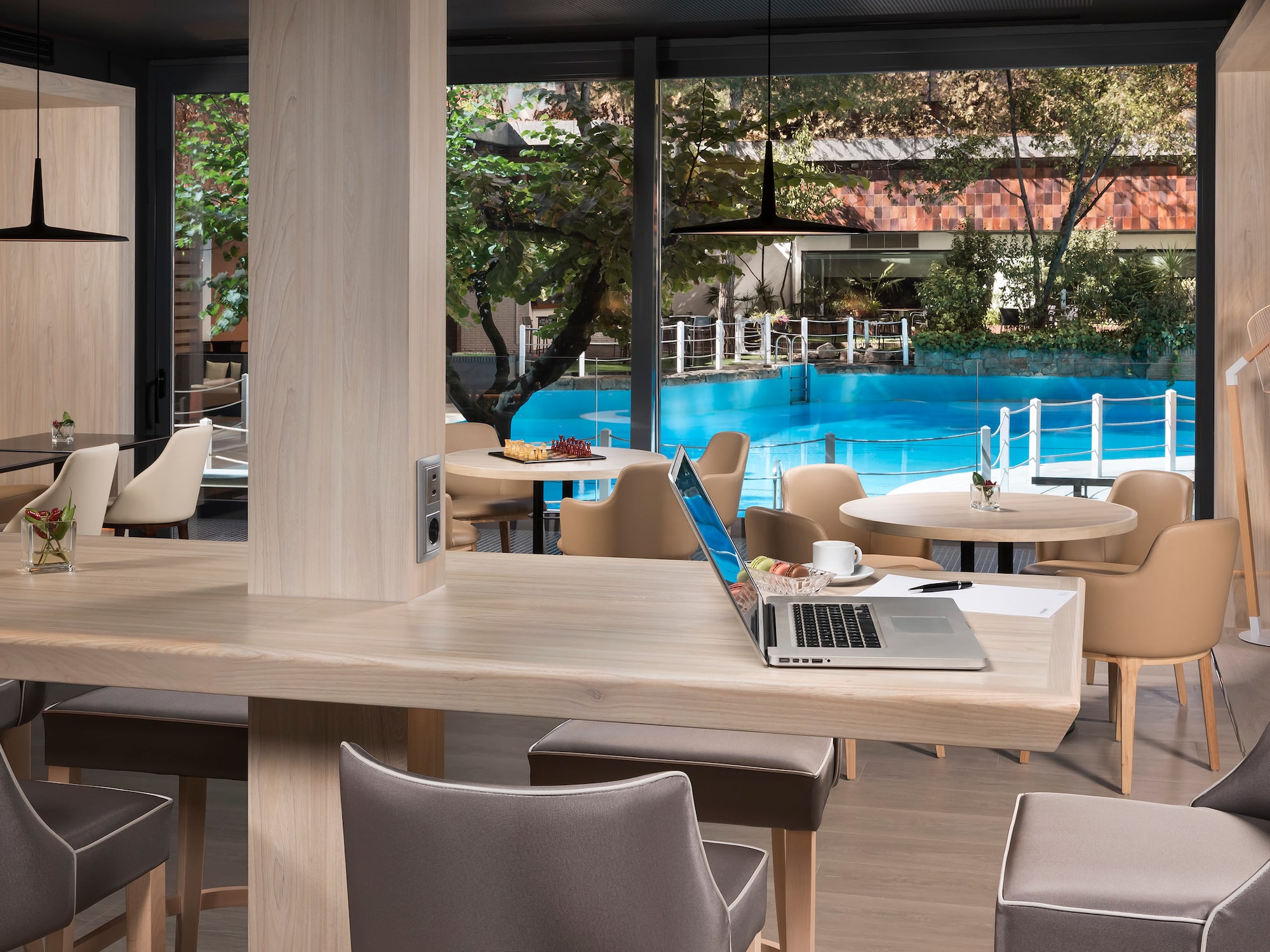 a laptop on a table in a restaurant