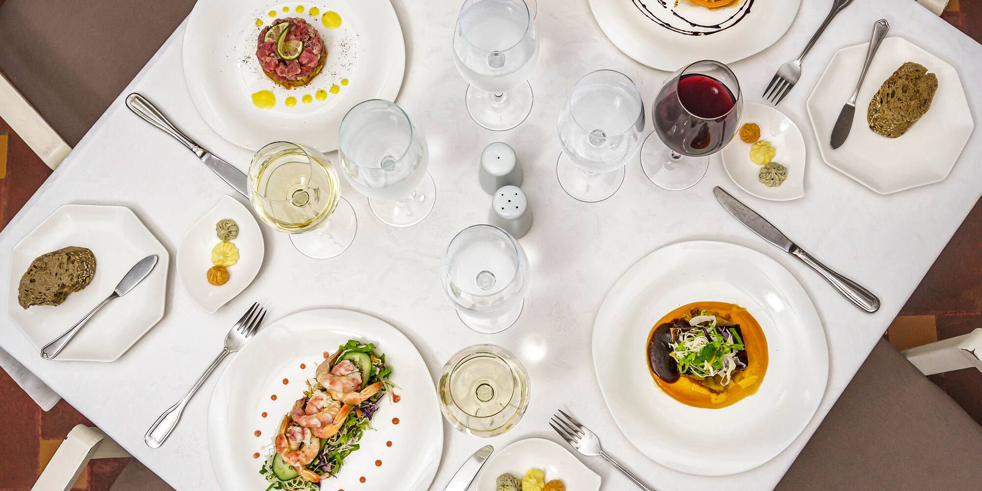 a table with plates and silverware