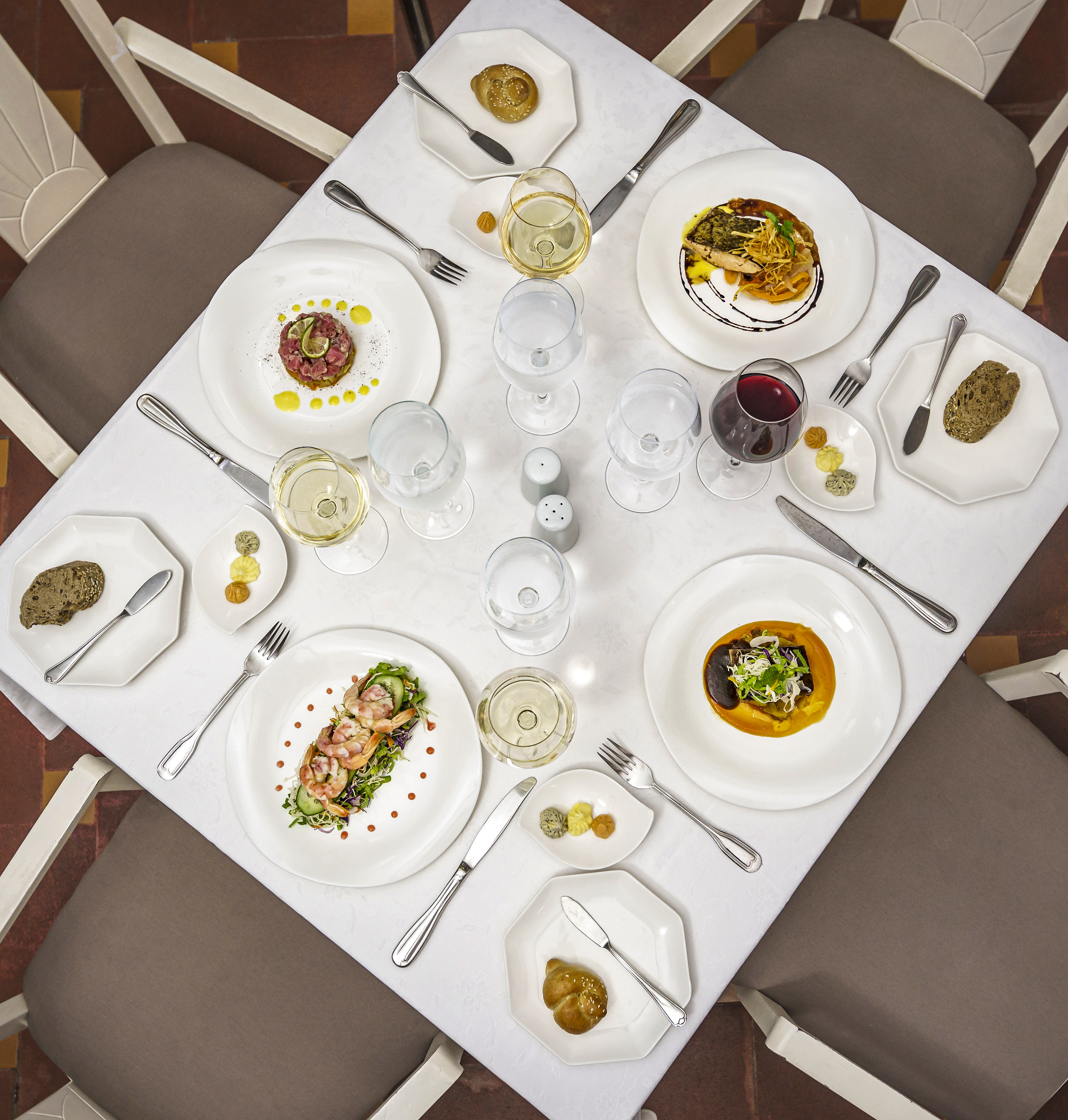 a table with plates and silverware