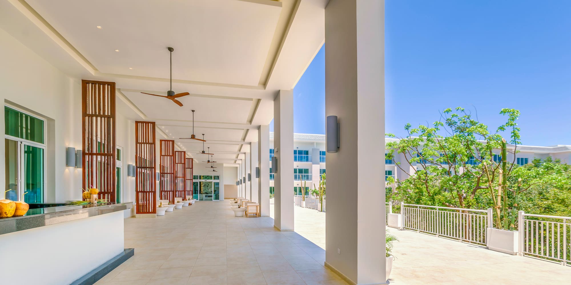 a building with white columns and a balcony