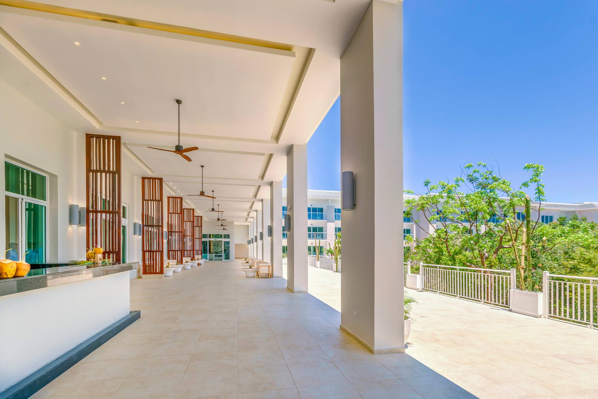 a building with white columns and a balcony