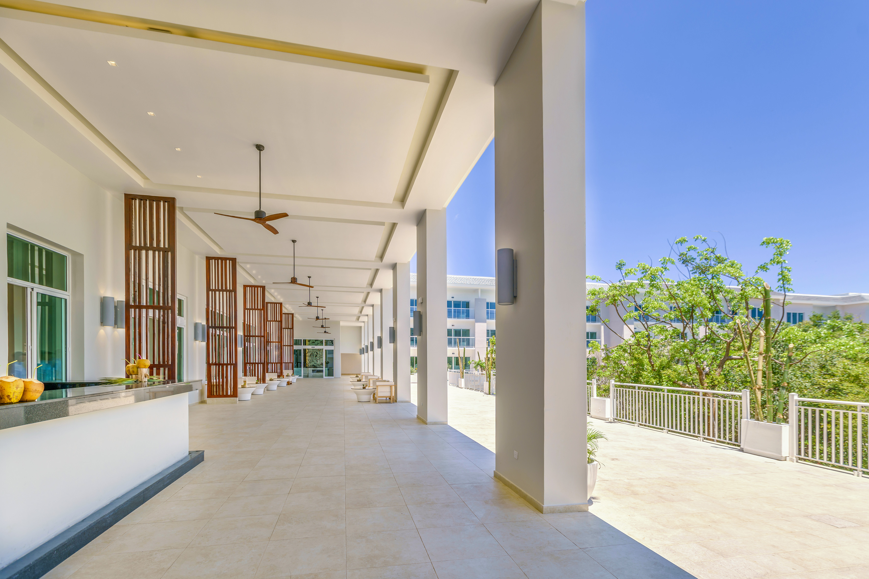a building with white columns and a balcony