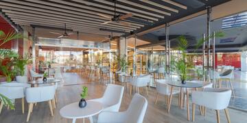 a room with tables and chairs