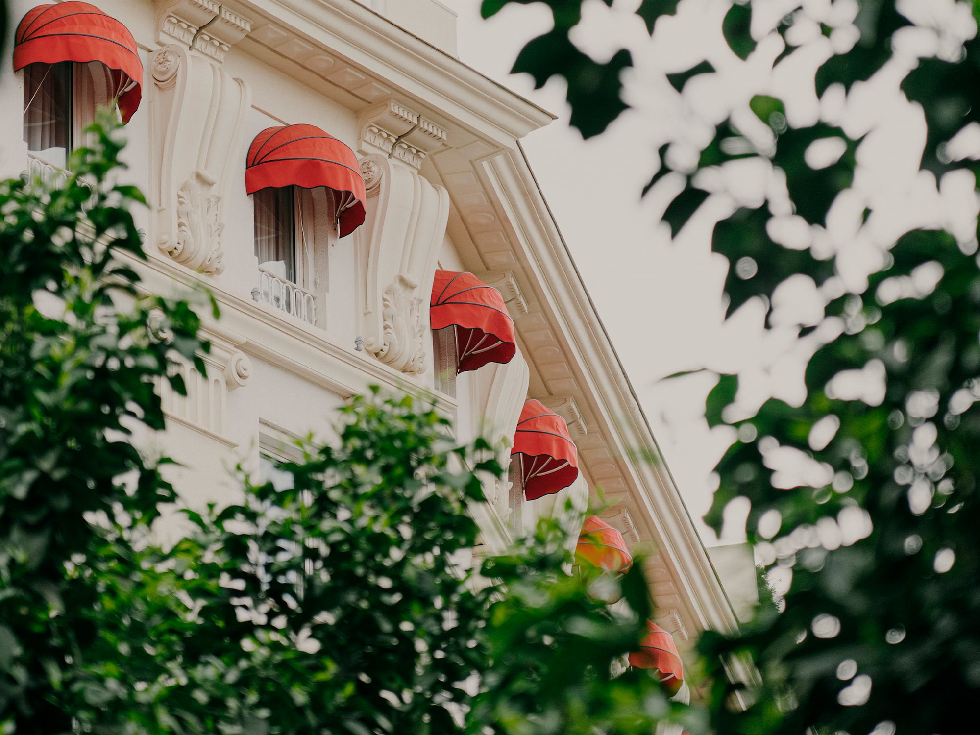 a building with red umbrellas