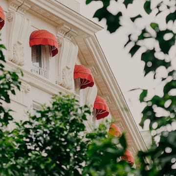 a building with red umbrellas