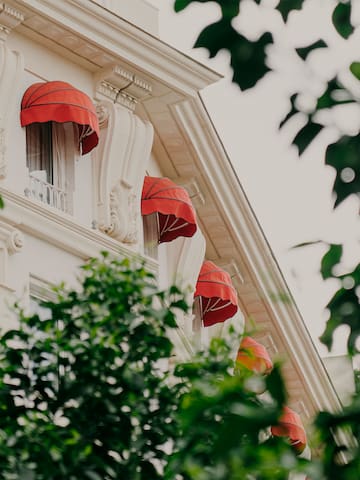a building with red umbrellas