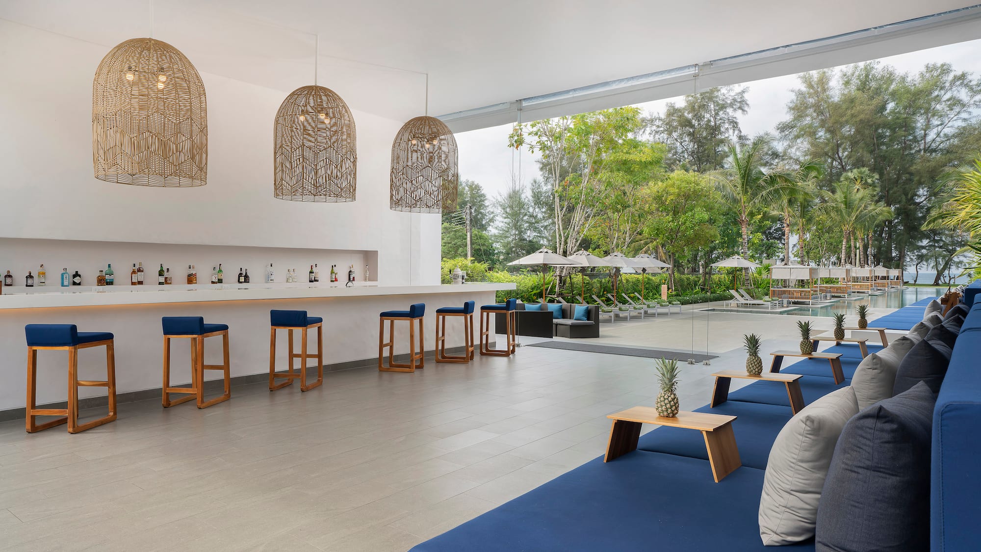 a pool with a bar and chairs