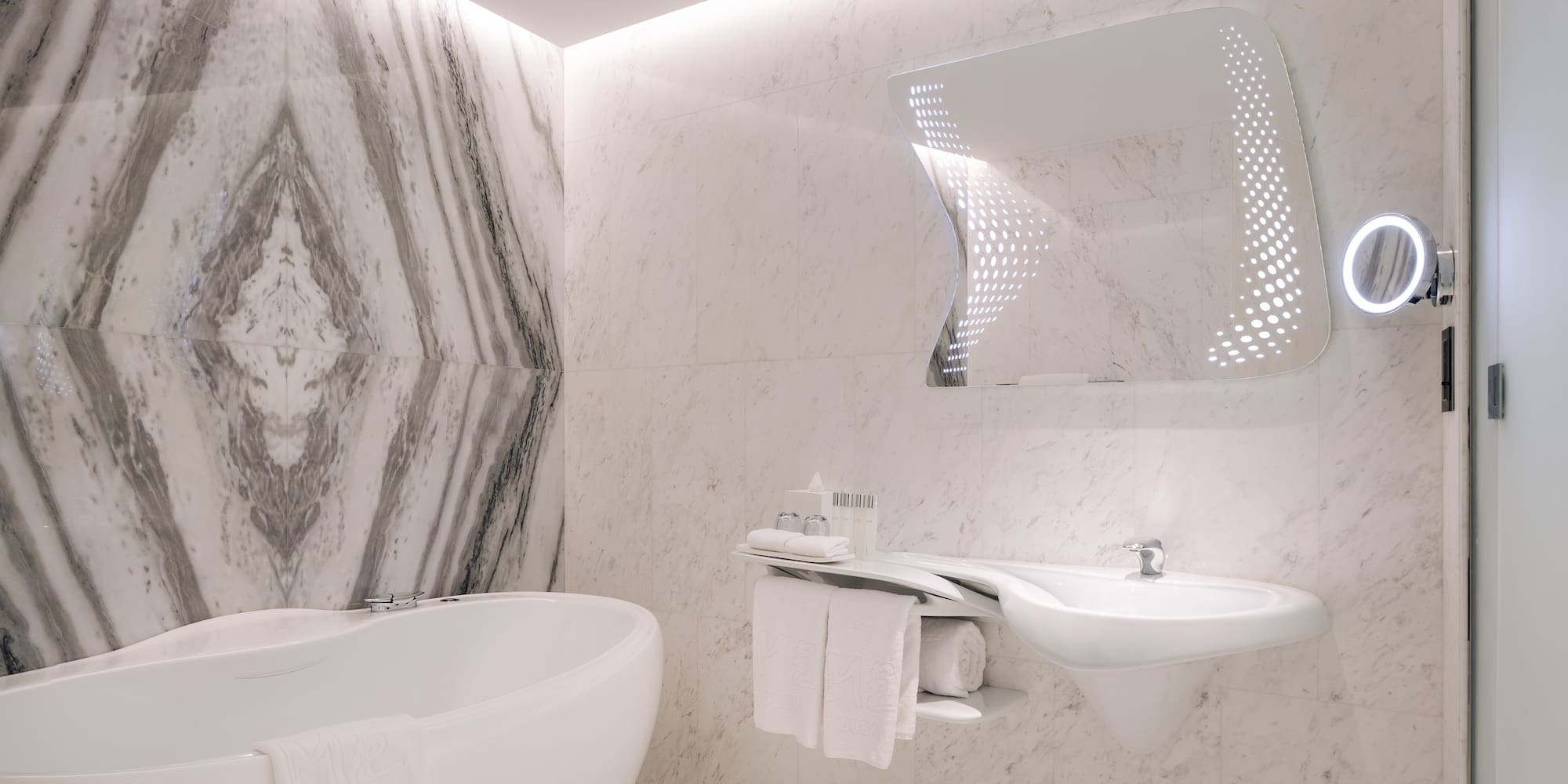 a bathroom with a tub and sink