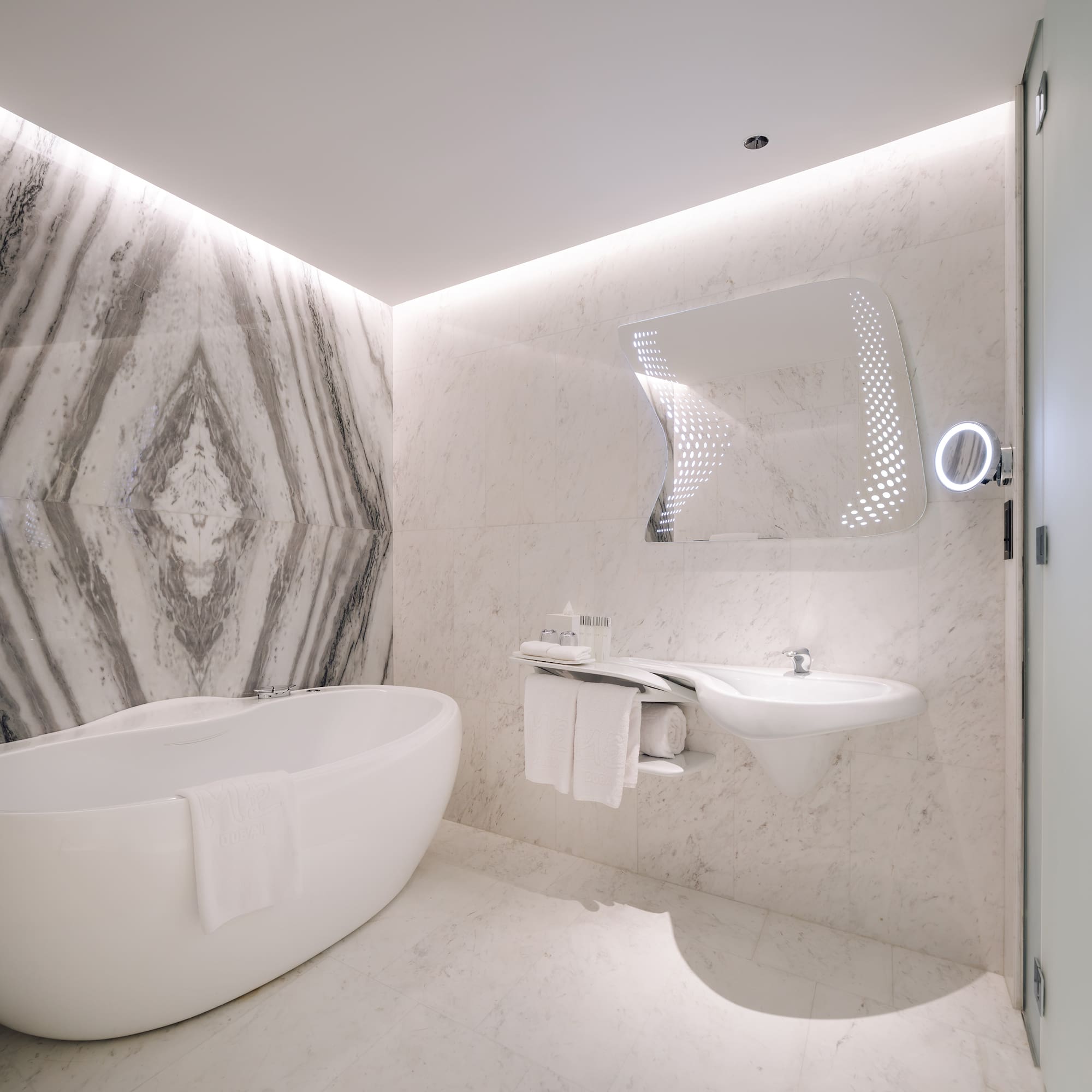 a bathroom with a tub and sink