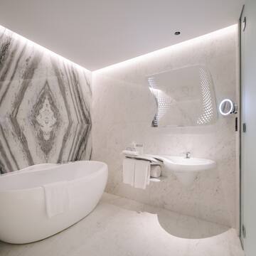 a bathroom with a tub and sink