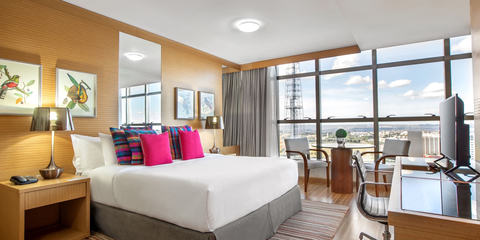 a room with a bed and a desk and a chair