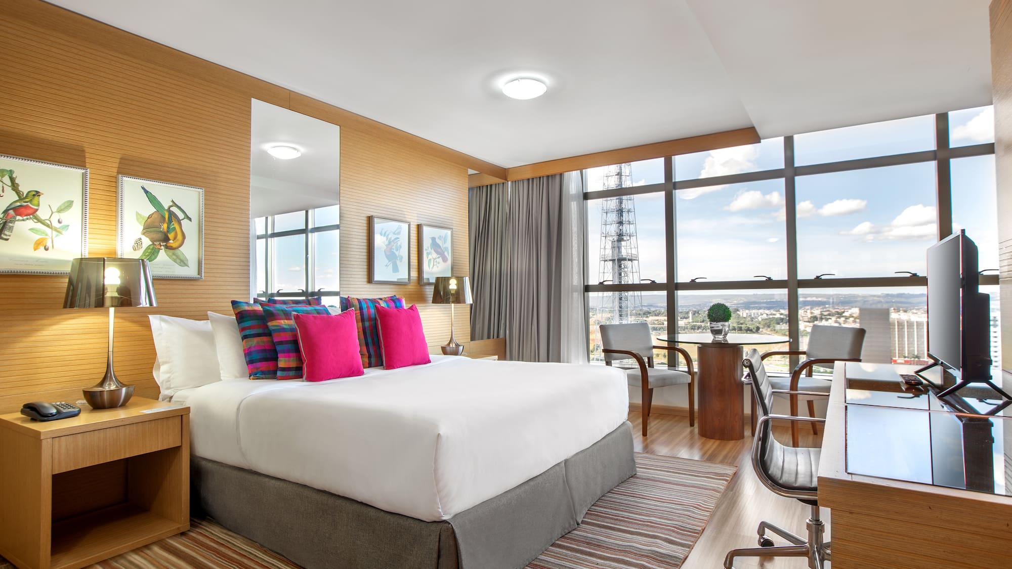 a room with a bed and a desk and a chair