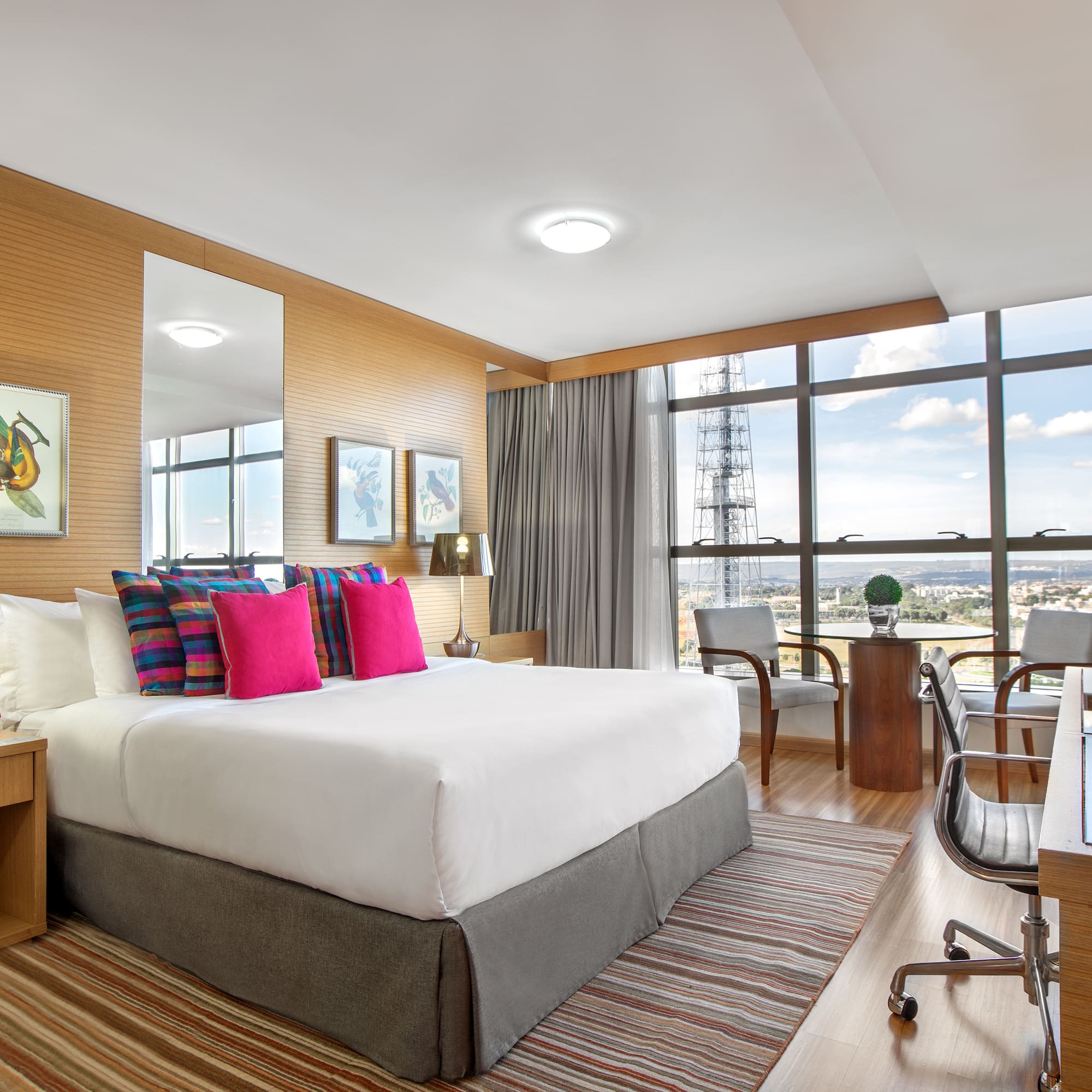 a room with a bed and a desk and a chair