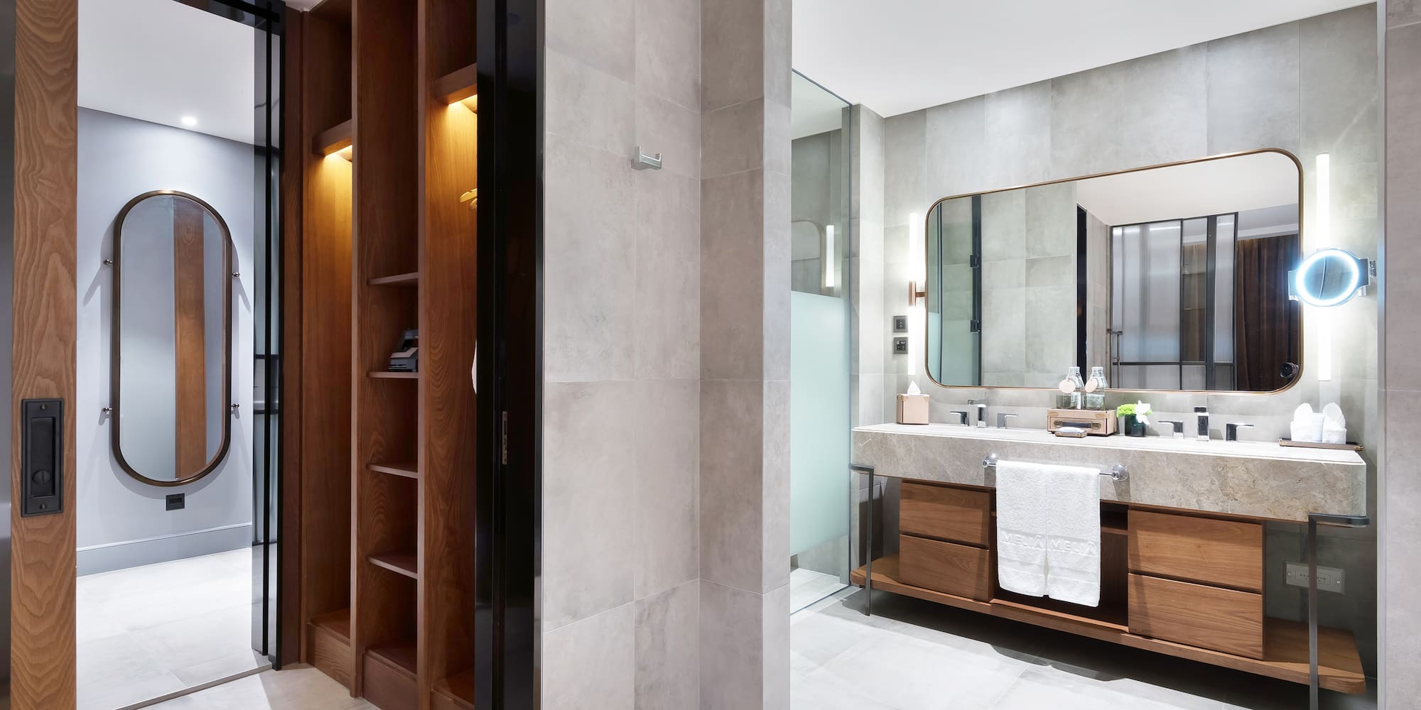 a bathroom with a mirror and shelves