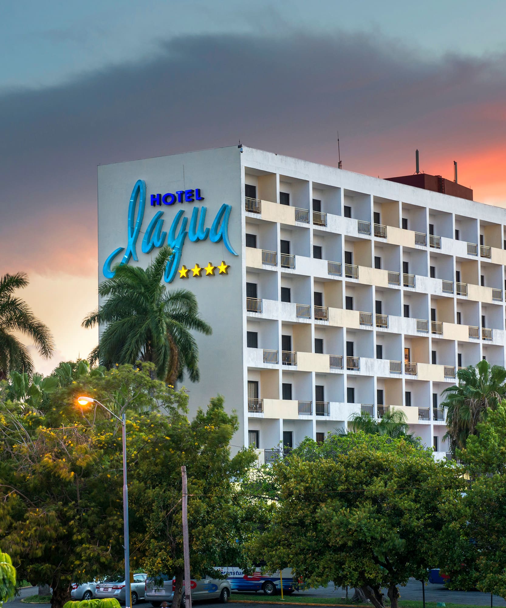 a building with trees and a sign