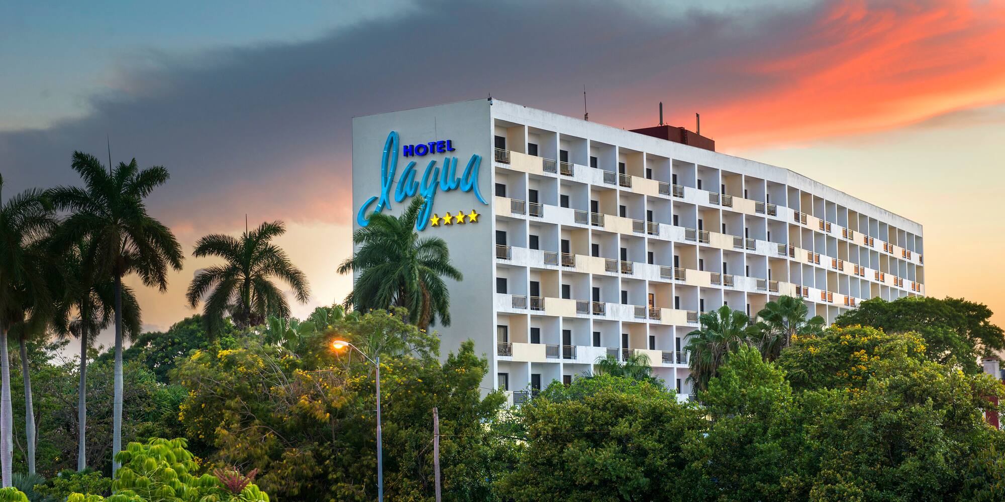 a building with trees and a sign
