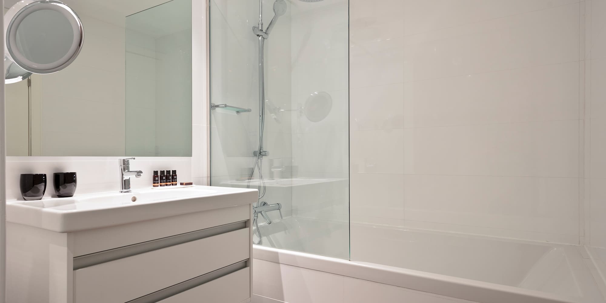 a bathroom with a shower and tub