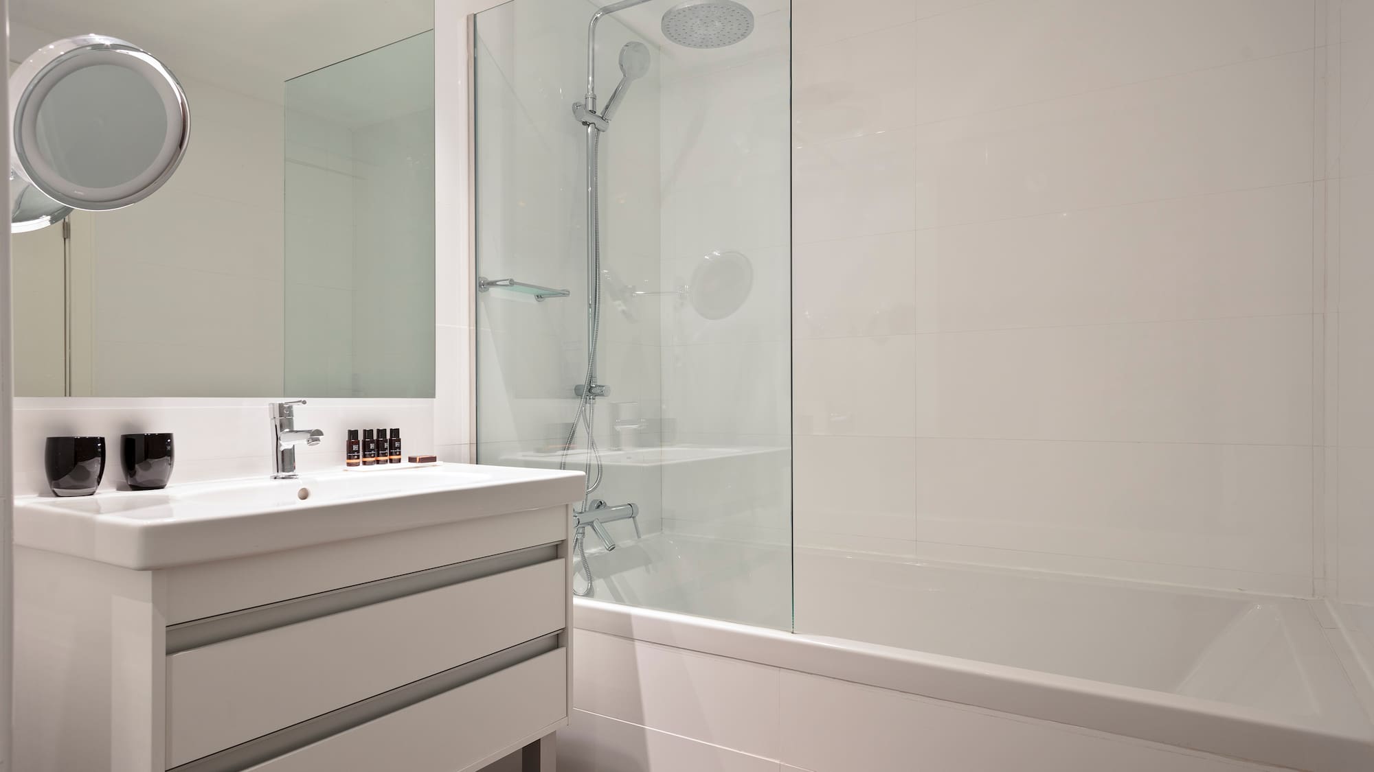 a bathroom with a shower and tub