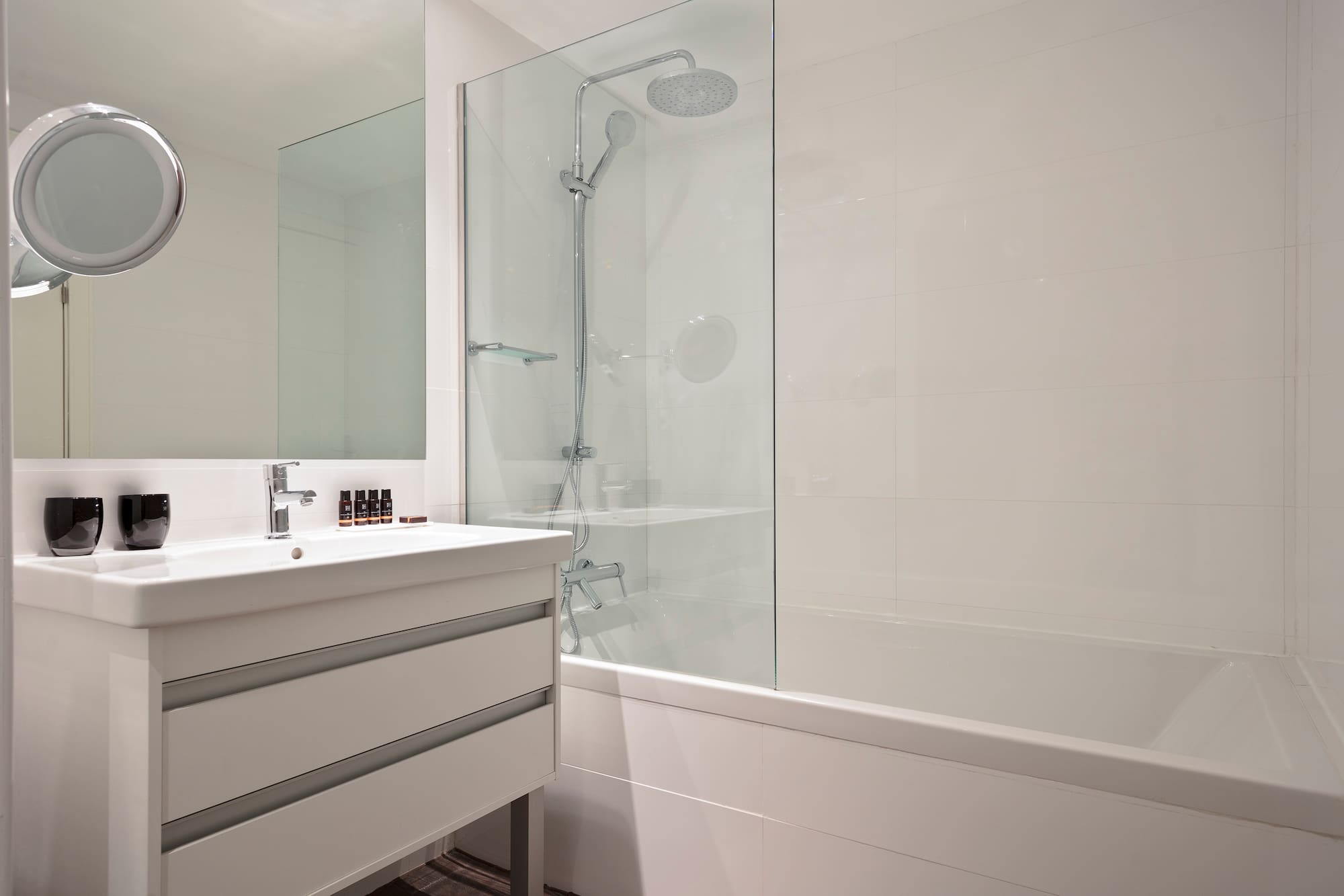 a bathroom with a shower and tub