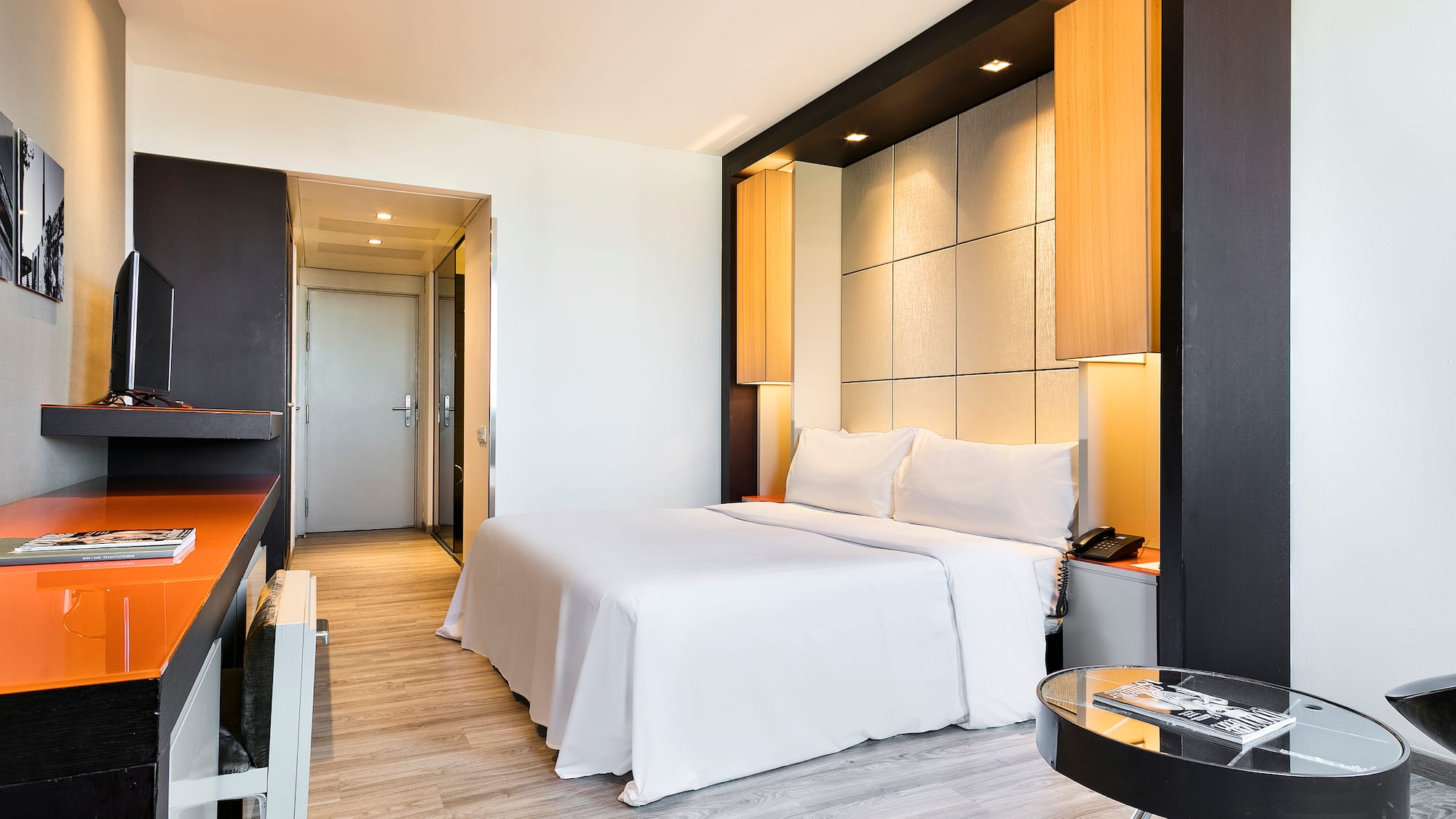 a room with a bed and a desk