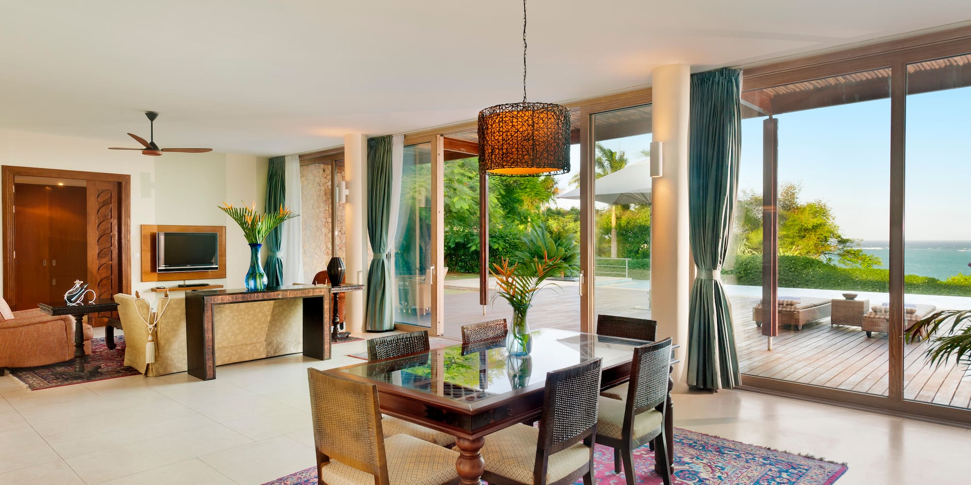 a dining table in a room with glass doors