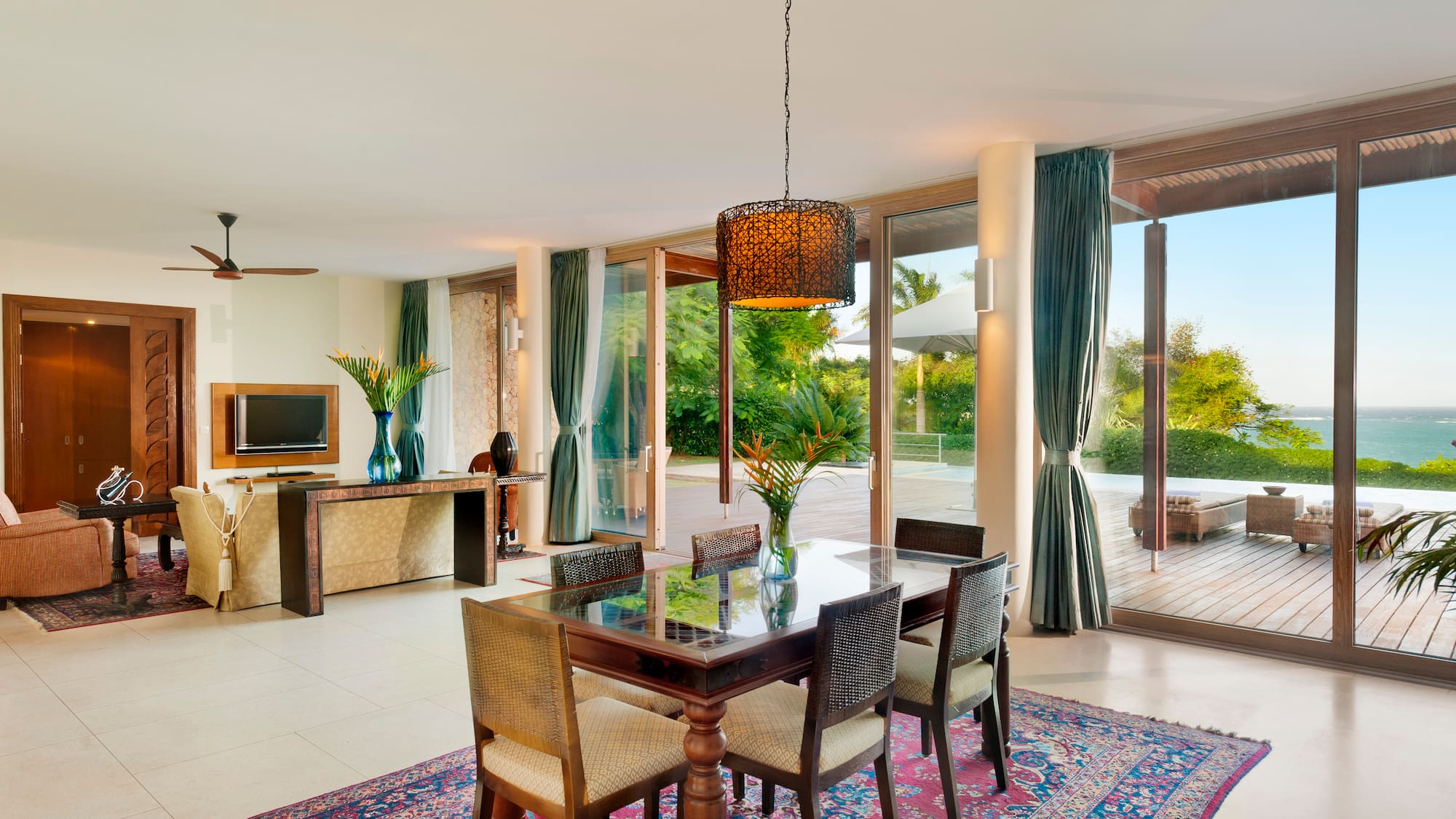 a dining table in a room with glass doors