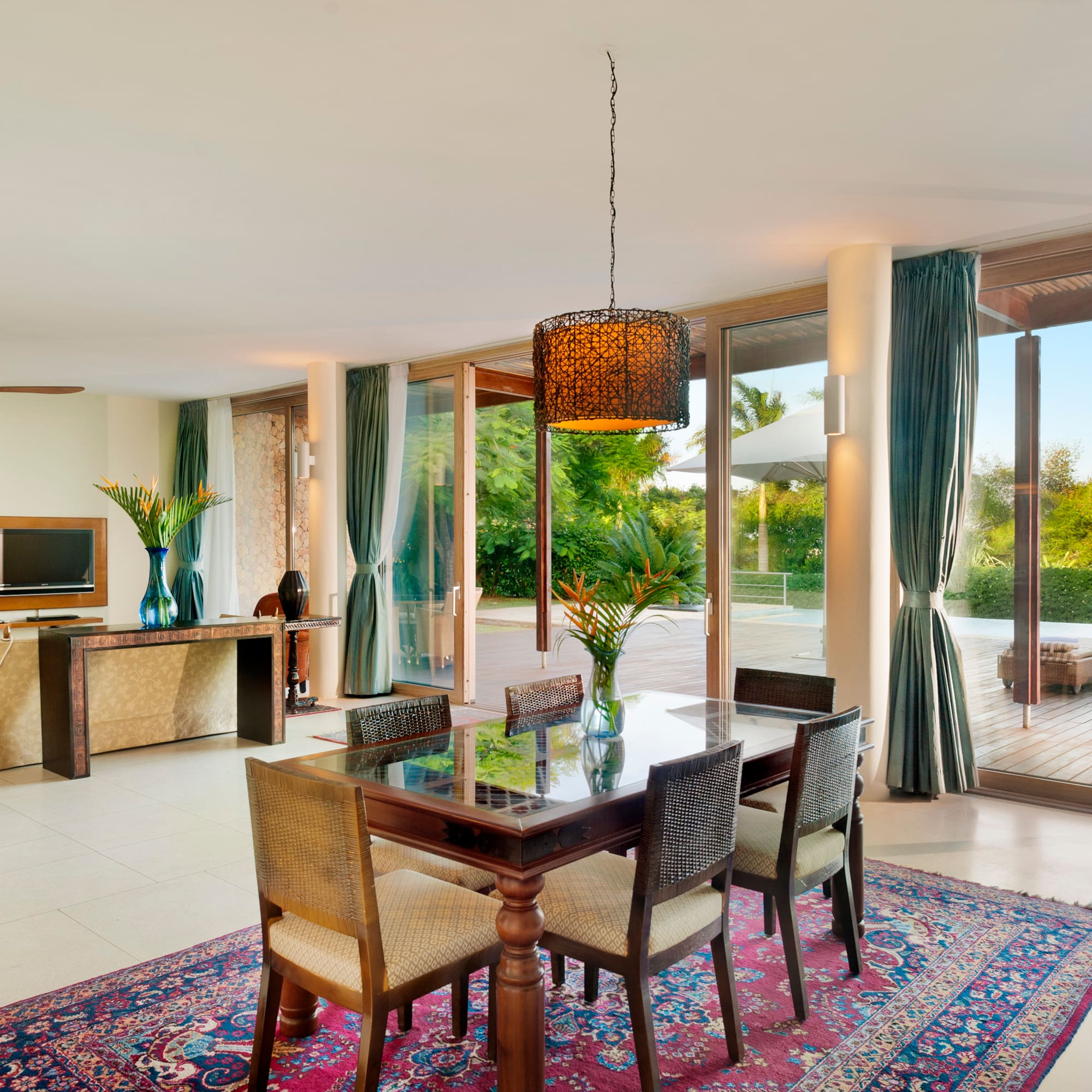 a dining table in a room with glass doors
