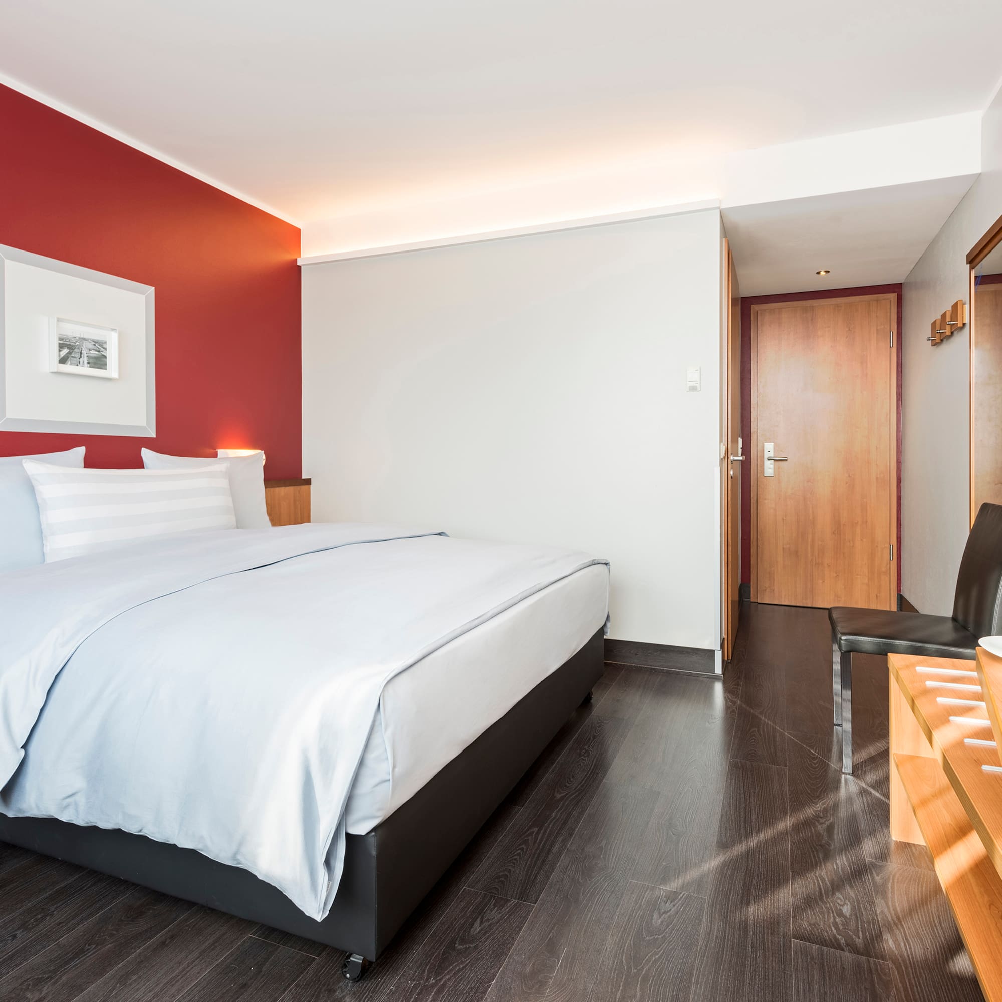 a room with a bed and a chair