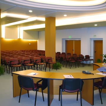 a room with chairs and a round table