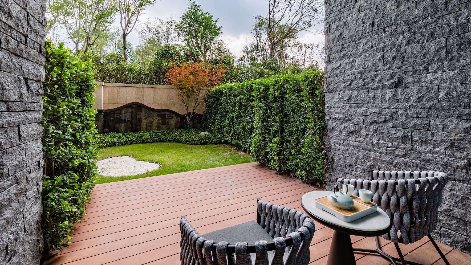 a patio with a table and chairs