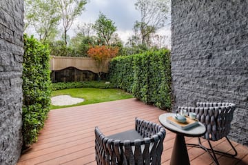 a patio with a table and chairs