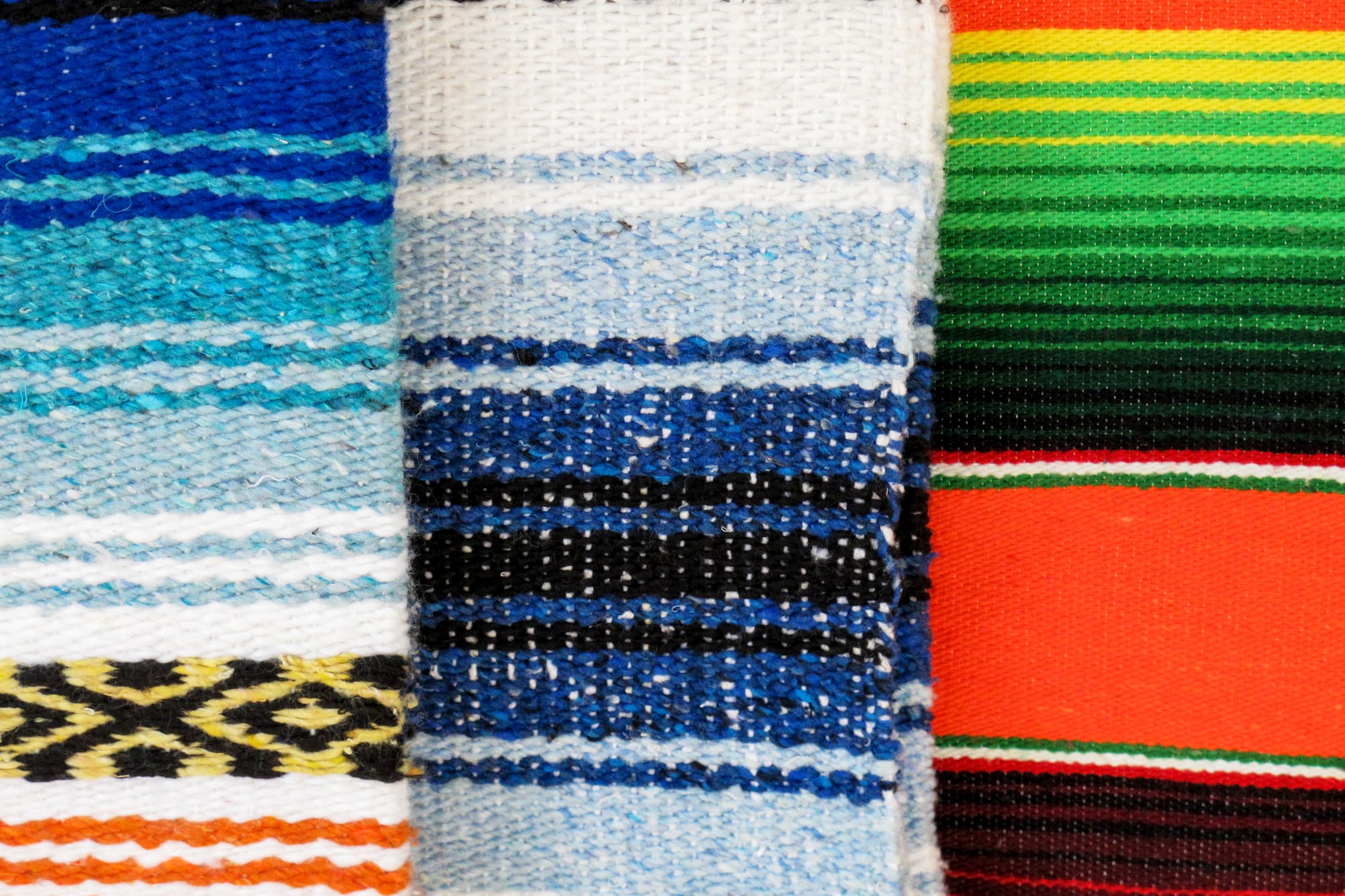 a group of colorful blankets