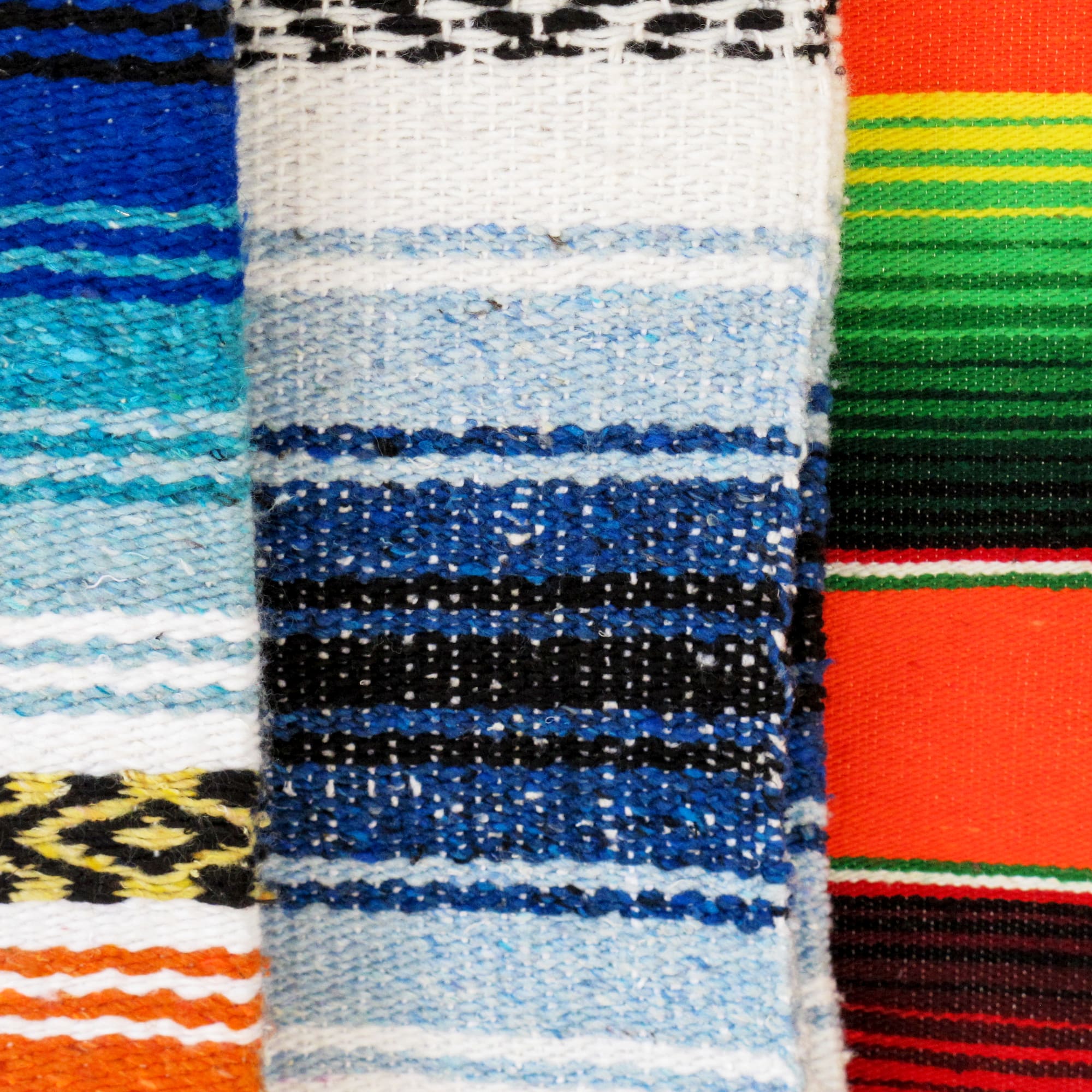 a group of colorful blankets