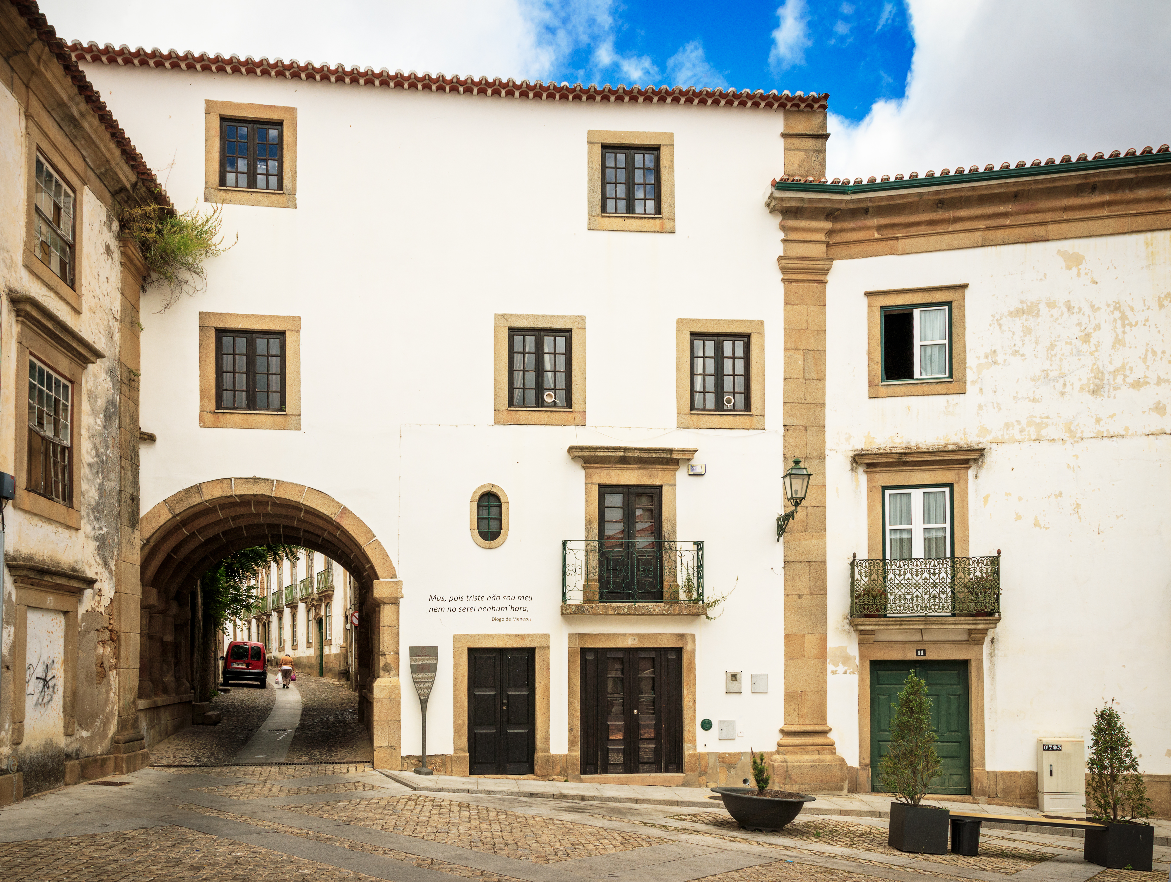 a white building with a archway