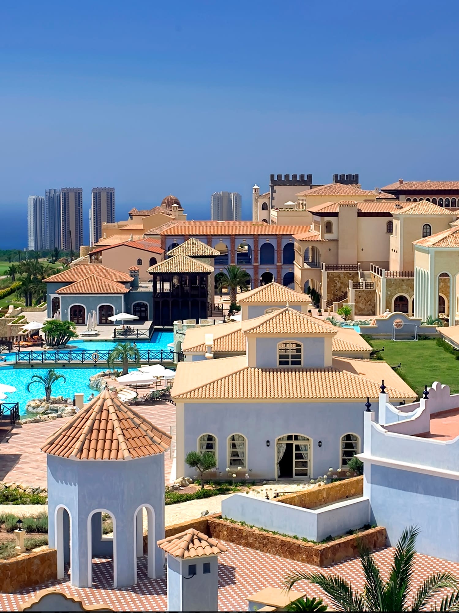 a large group of buildings with a pool