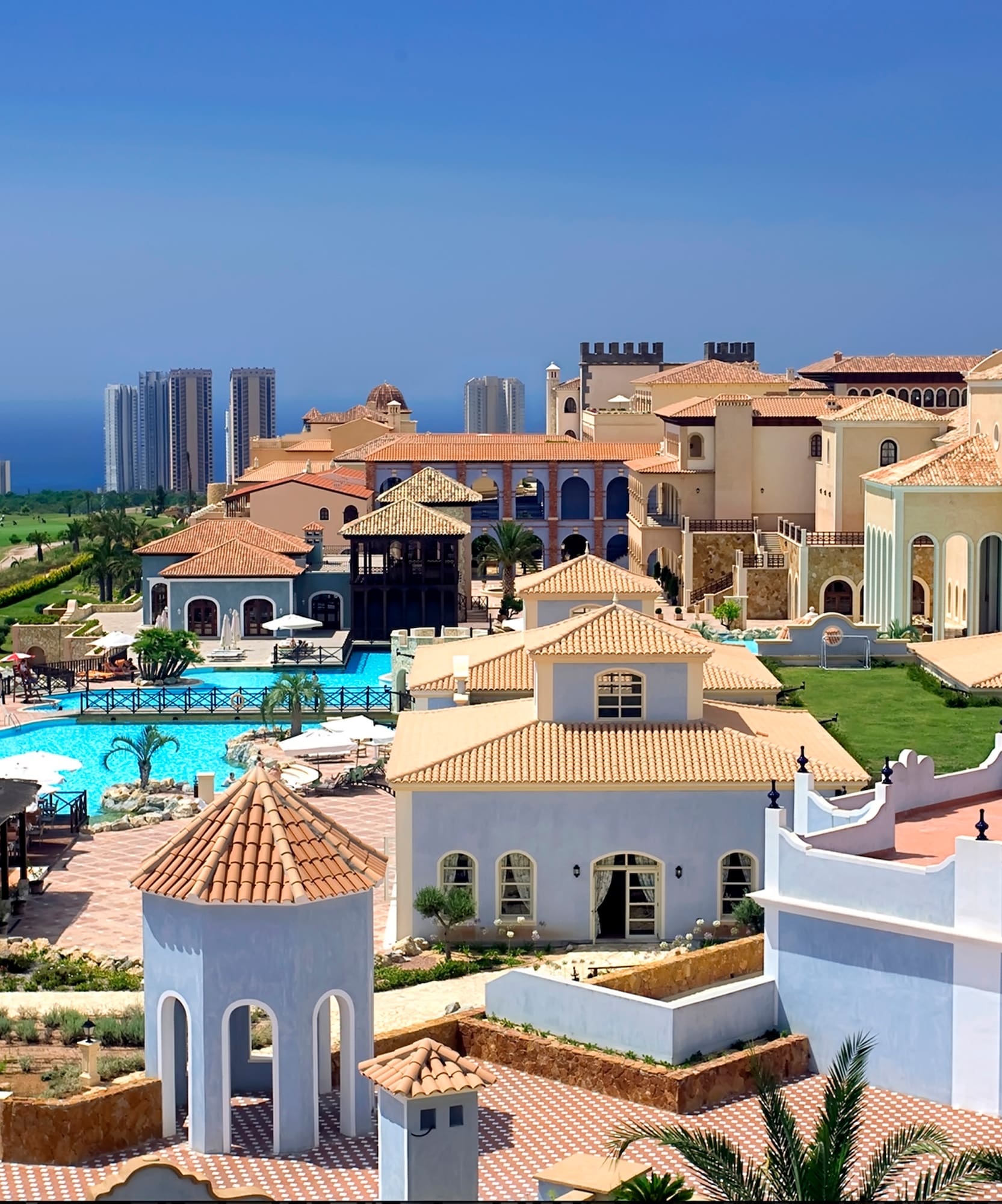 a large group of buildings with a pool