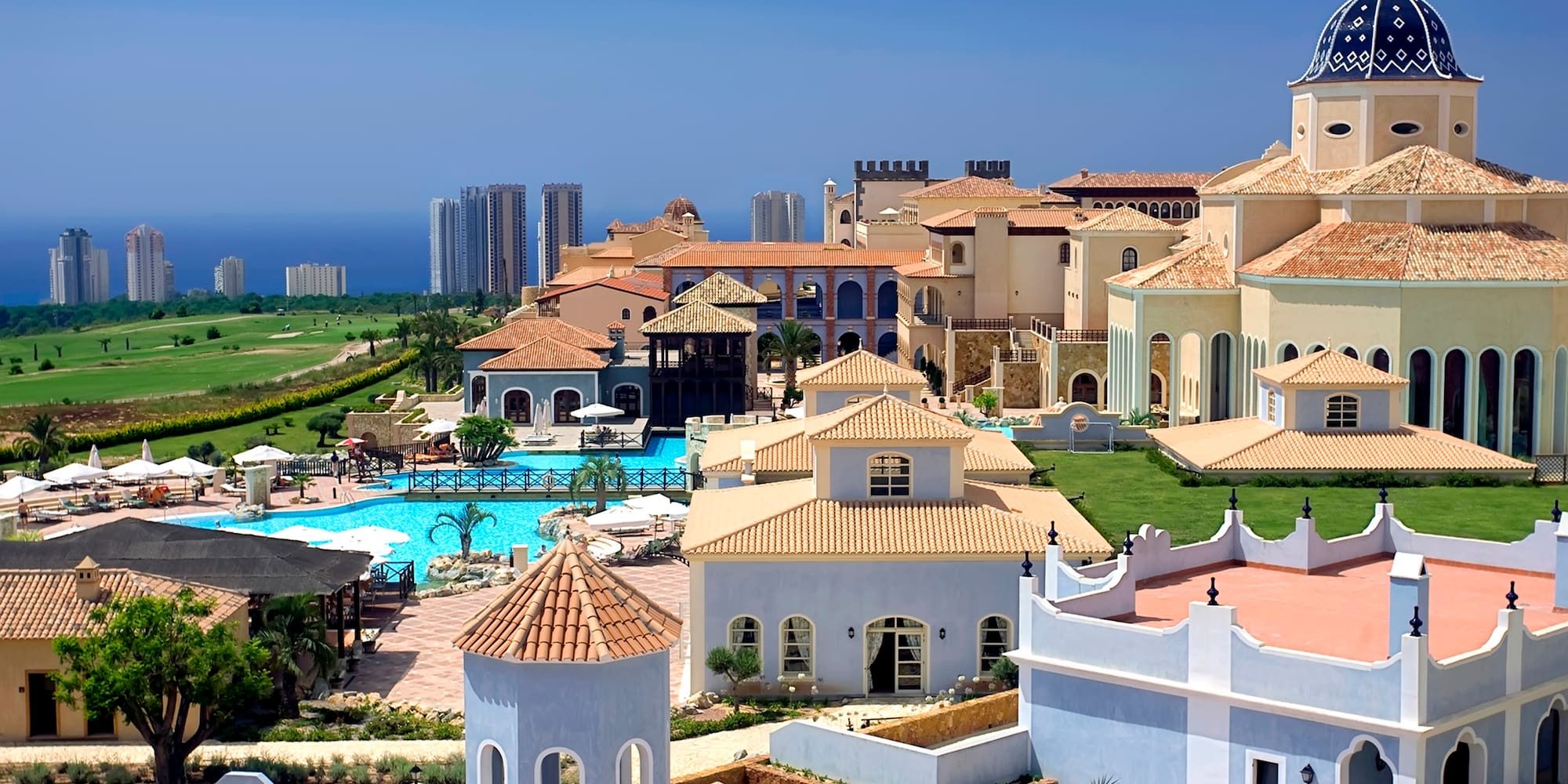 a large group of buildings with a pool