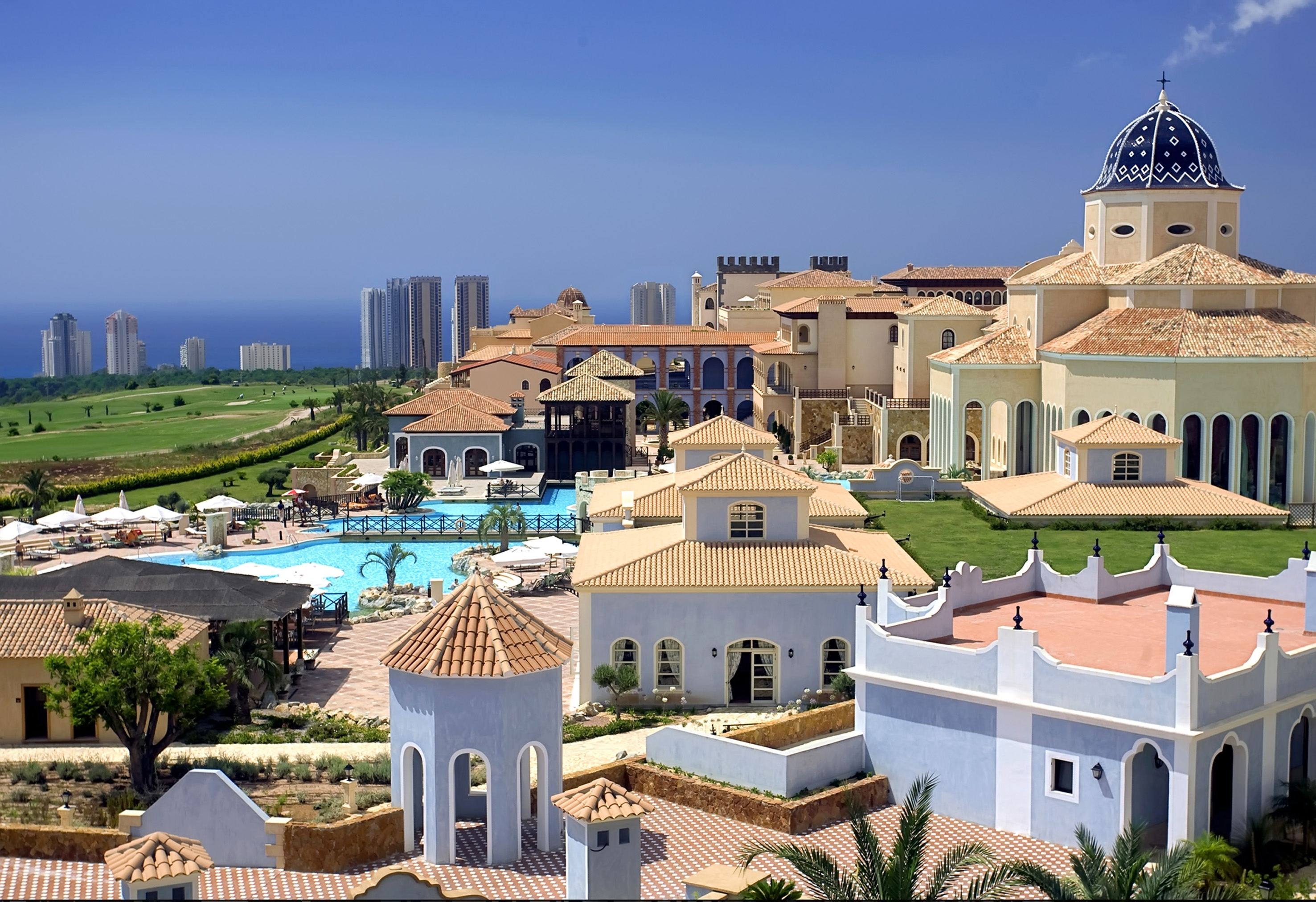 a large group of buildings with a pool