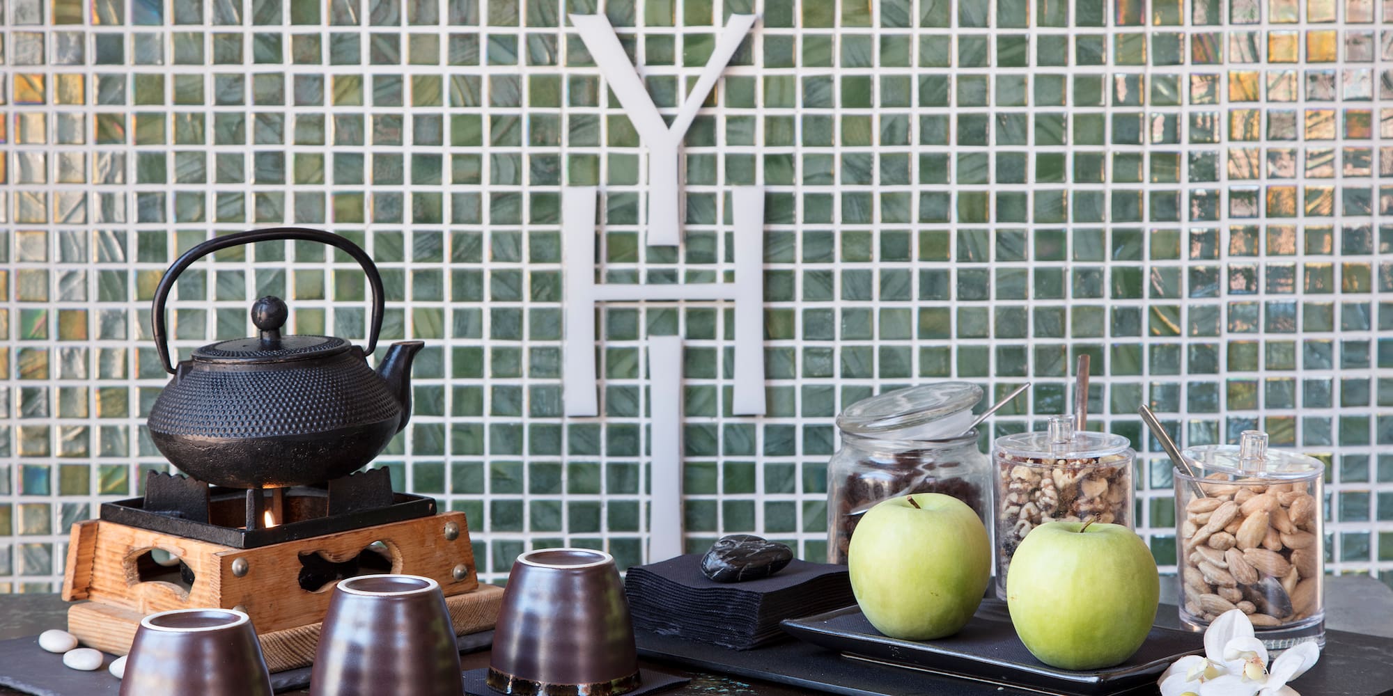 a table with a teapot and cups on it
