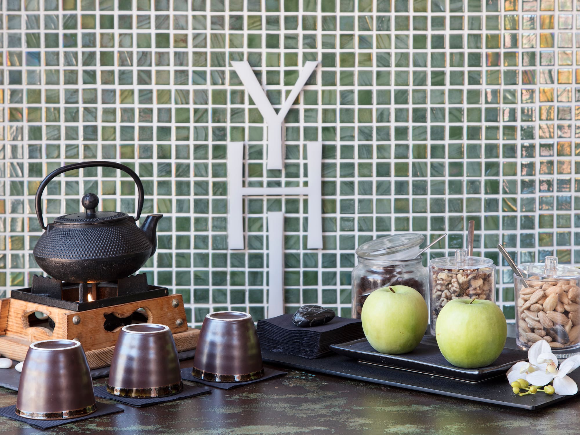 a table with a teapot and cups on it