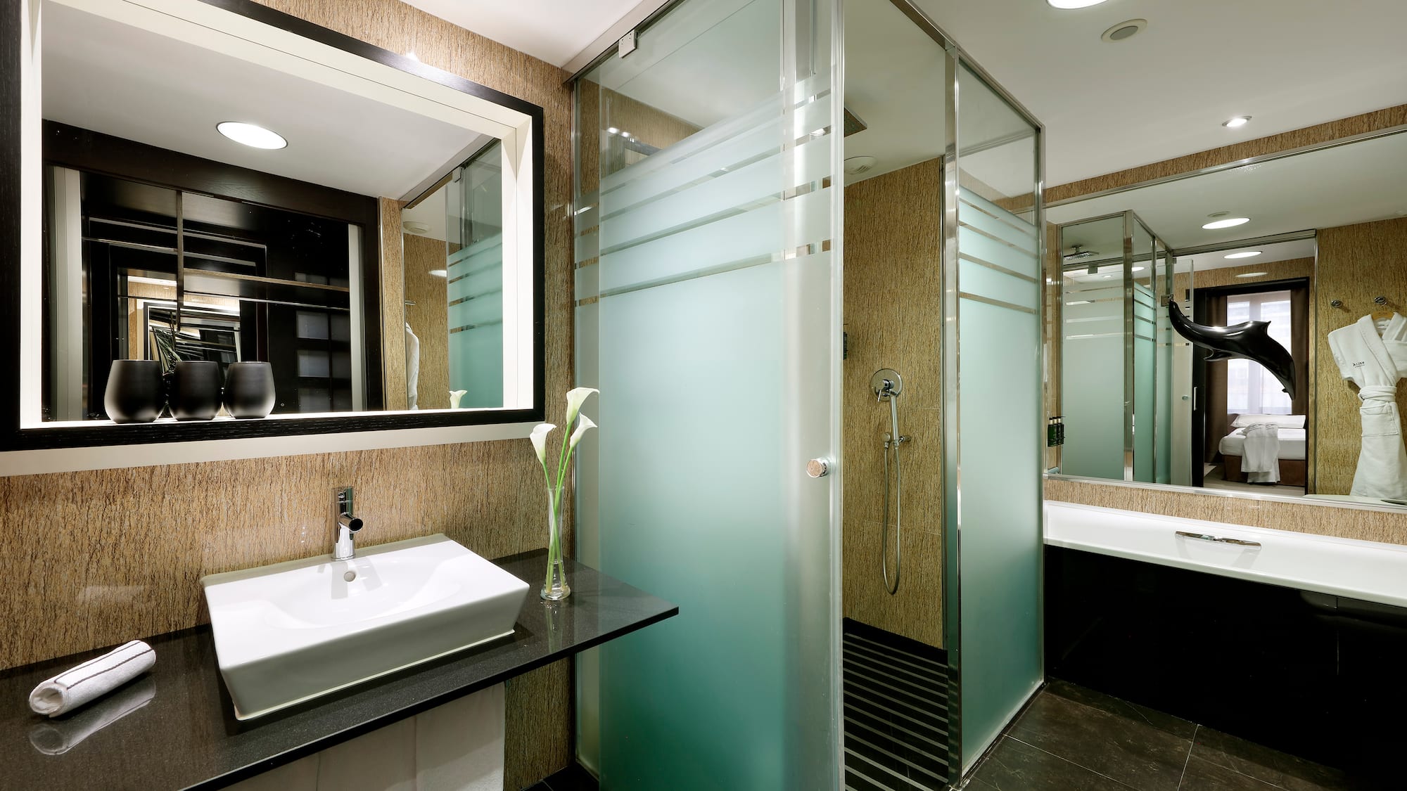 a bathroom with a shower and sink