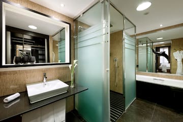a bathroom with a shower and sink