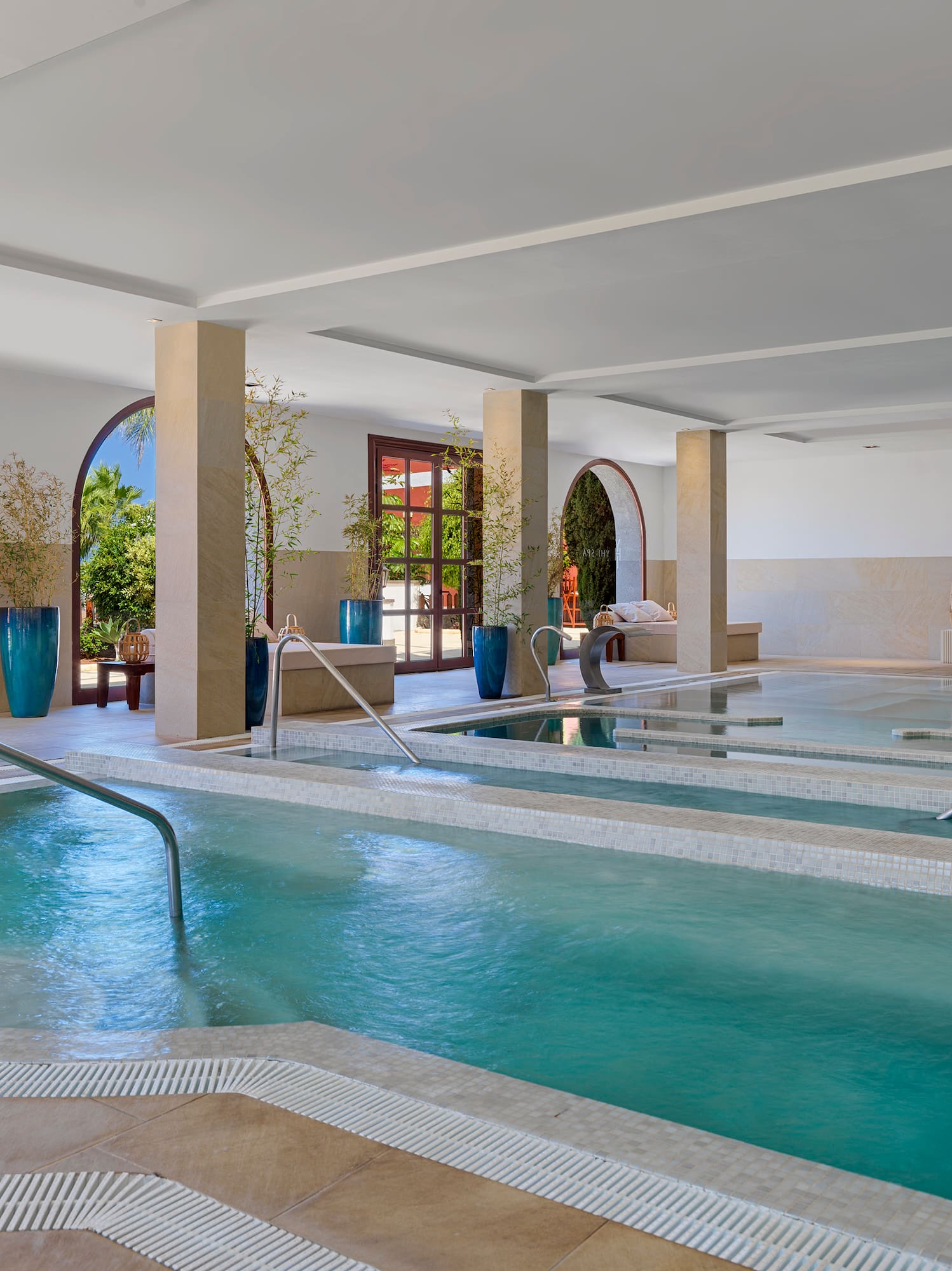 a large indoor pool with a large staircase