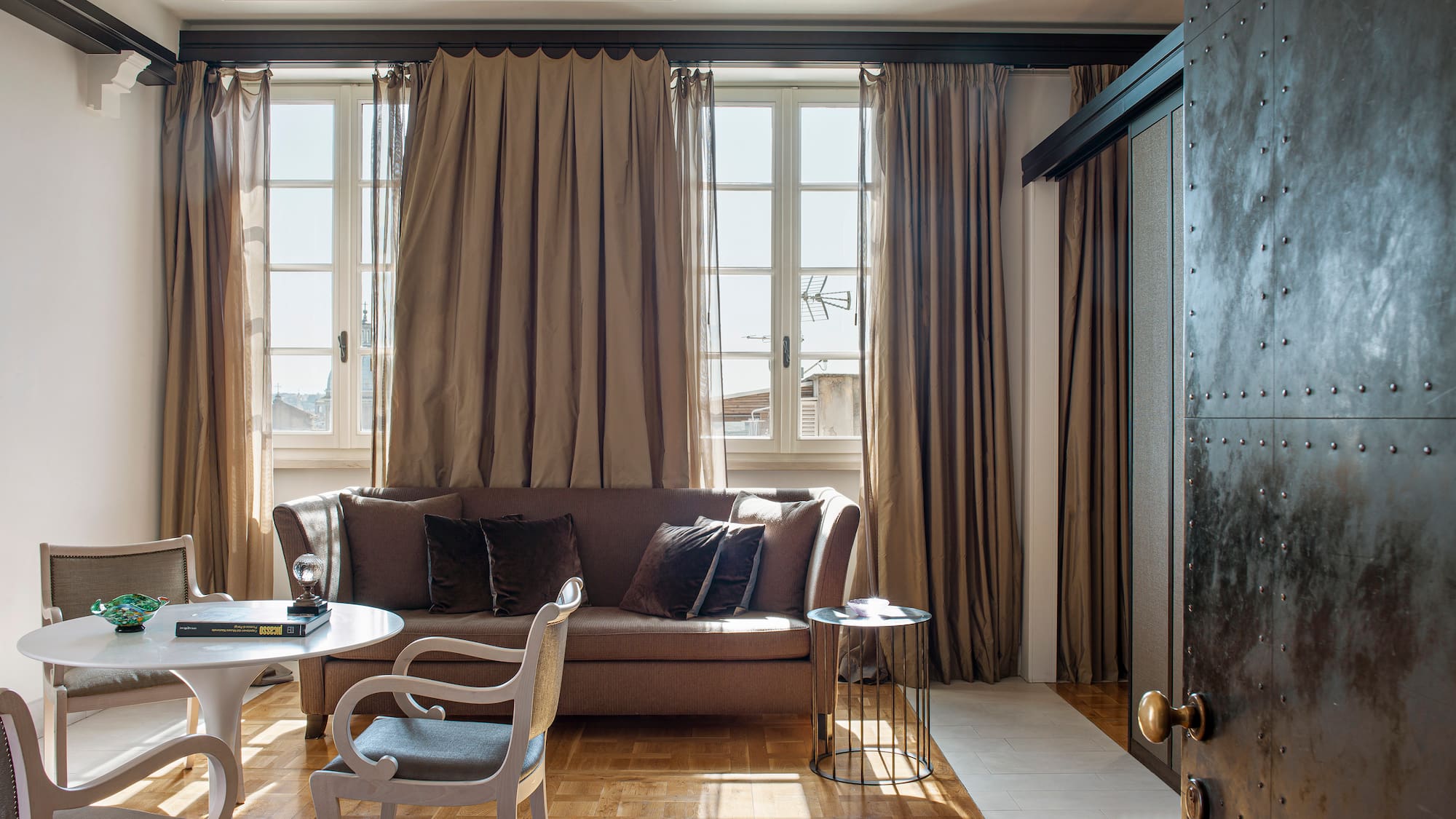 a living room with a couch and chairs