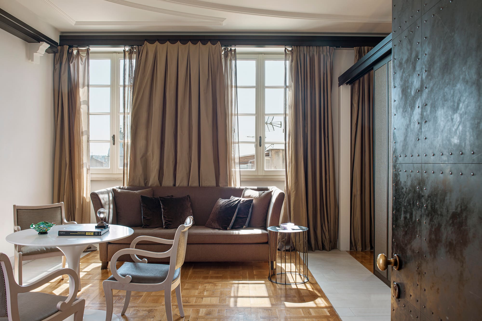 a living room with a couch and chairs