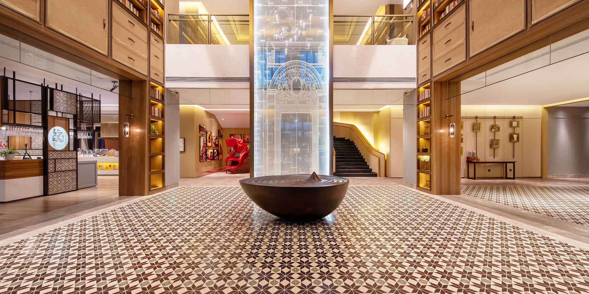 a large room with a large glass pillar and a large glass wall