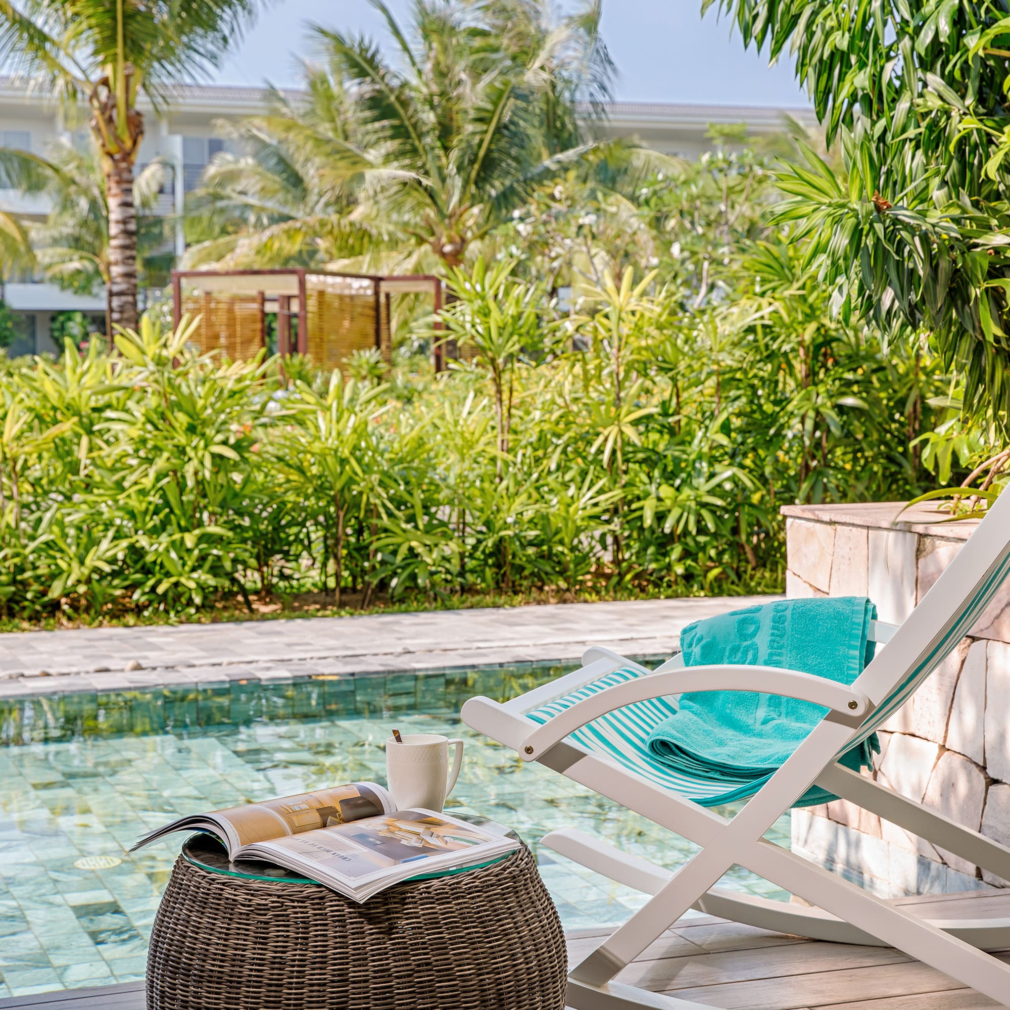 a chair next to a pool