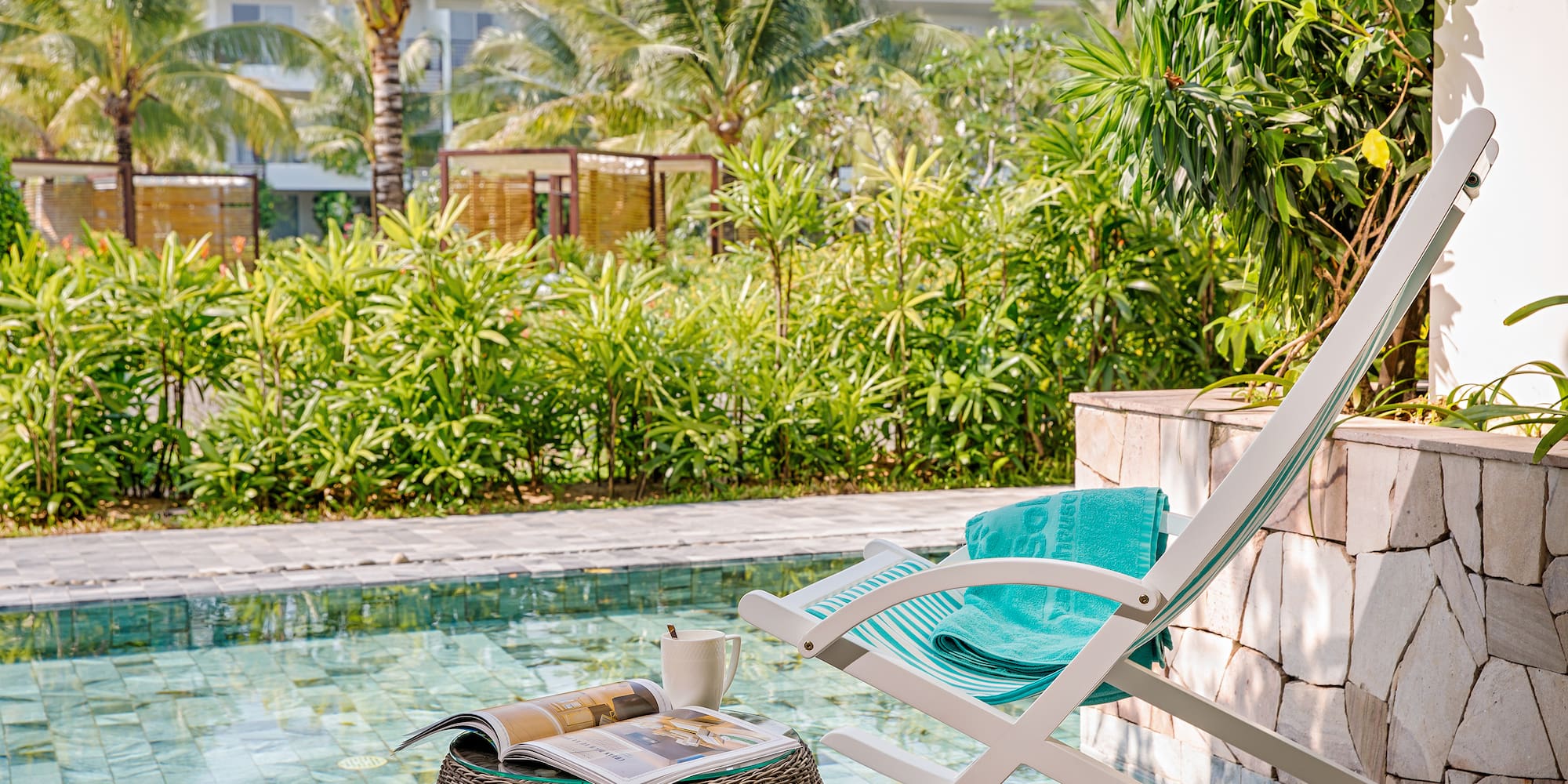 a chair next to a pool