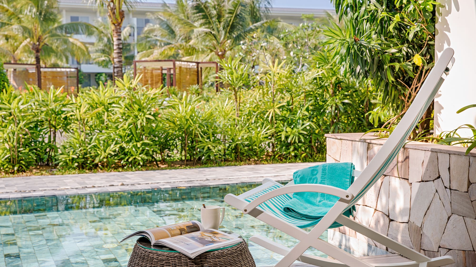a chair next to a pool